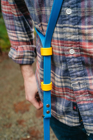 Eco adjustable length hands-free Biothane leash in use, featuring blue color and yellow adjustable fasteners.