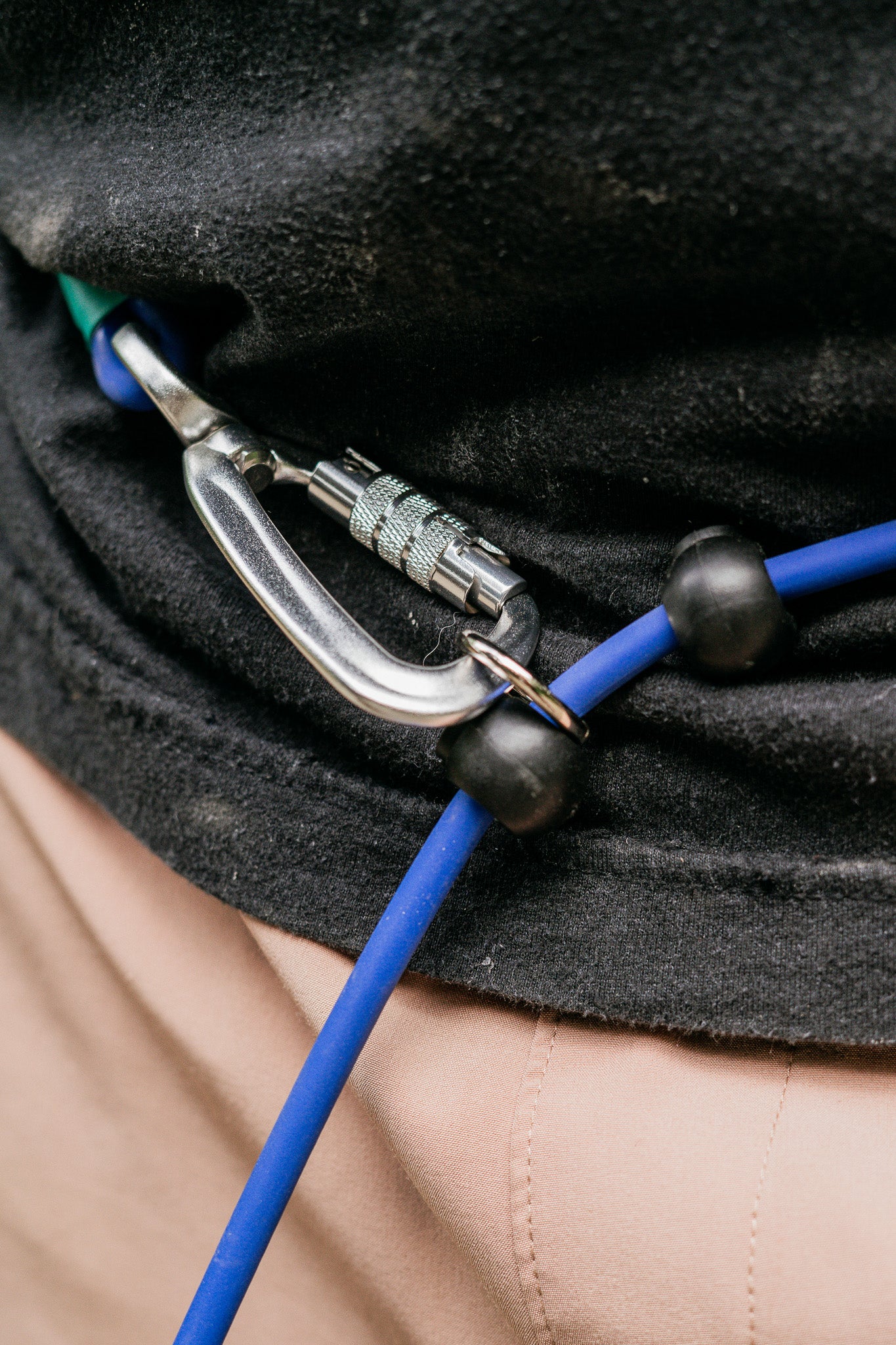 Close-up of a hands-free BioThane® leash attachment with a carabiner, showcasing durability and functionality.